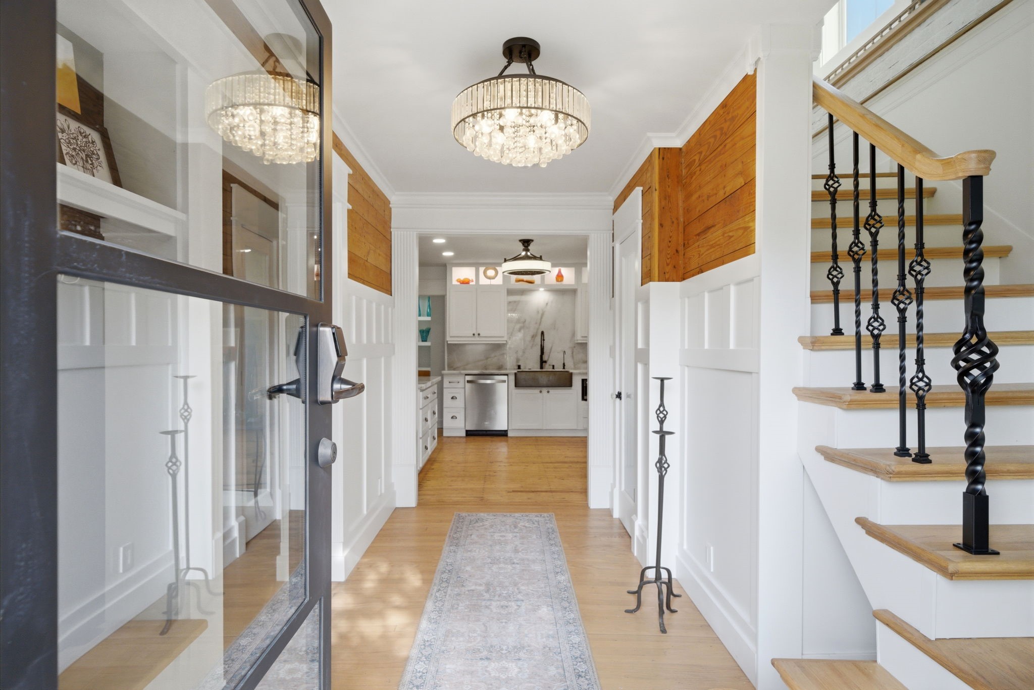 3128 Prospect Street Houston, TX 77004 - Photo 4 of 36 a view of a hallway with a dining table & chairs
