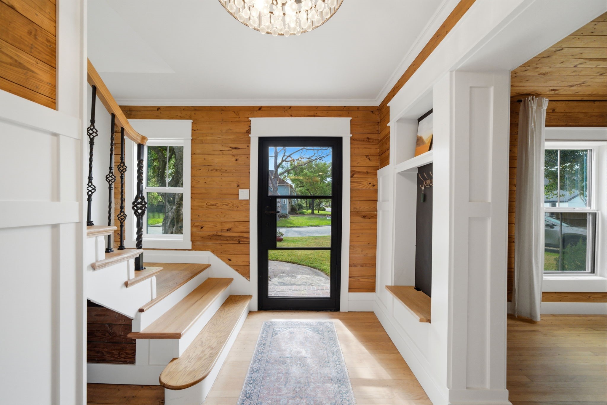 3128 Prospect Street Houston, TX 77004 - Photo 5 of 36 a view of a hallway with wooden floor and a living room