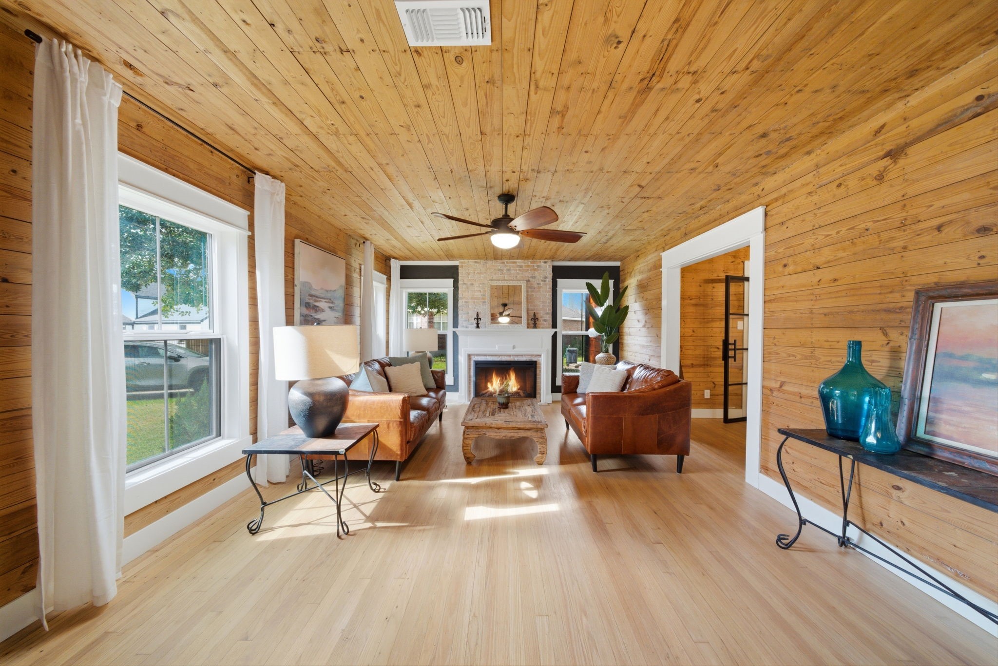3128 Prospect Street Houston, TX 77004 - Photo 6 of 36 a living room with furniture a fireplace and a potted plant