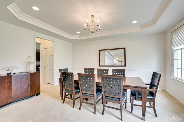a view of a work space with wooden floor and a window