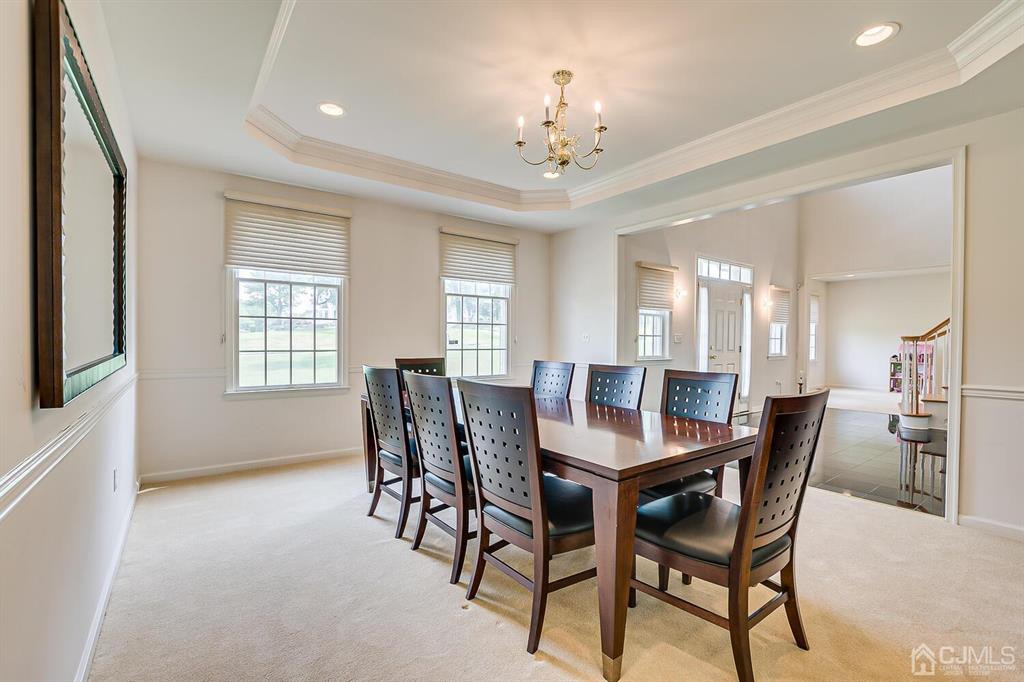 12 Hayduk Drive Edison, NJ 08820 - Photo 15 of 64 a view of a dining room with furniture and chandelier
