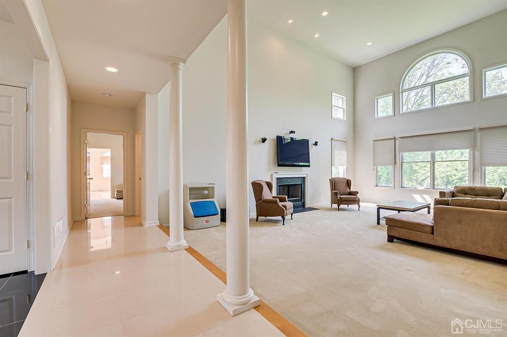 12 Hayduk Drive Edison, NJ 08820 - Photo 24 of 64 a living room with furniture a fireplace and a large window