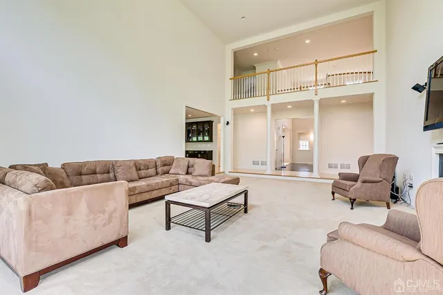 a large kitchen with stainless steel appliances granite countertop a sink stove and refrigerator