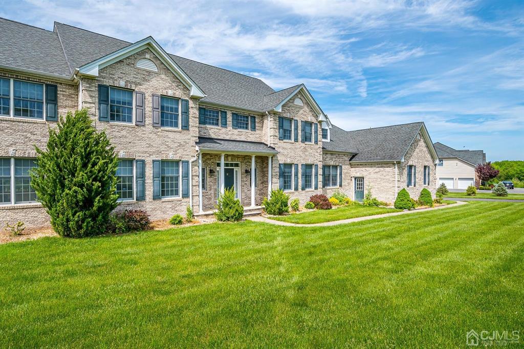 12 Hayduk Drive Edison, NJ 08820 - Photo 3 of 64 a front view of a house with a yard porch and outdoor seating