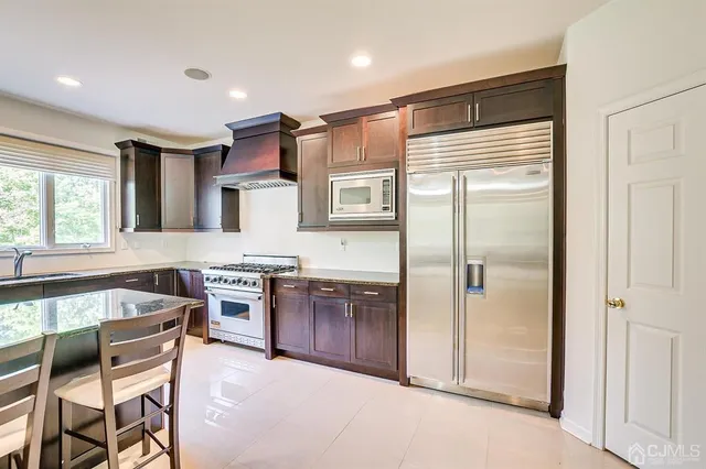 a spacious bedroom with a bed and a couch