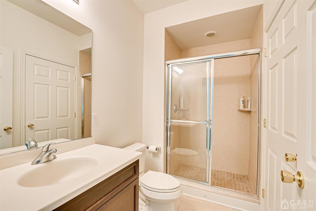 12 Hayduk Drive Edison, NJ 08820 - Photo 39 of 64 a bathroom with a sink a toilet and shower