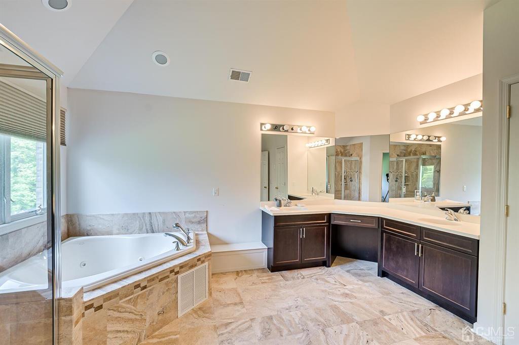 12 Hayduk Drive Edison, NJ 08820 - Photo 48 of 64 a large bathroom with a tub sink and mirror