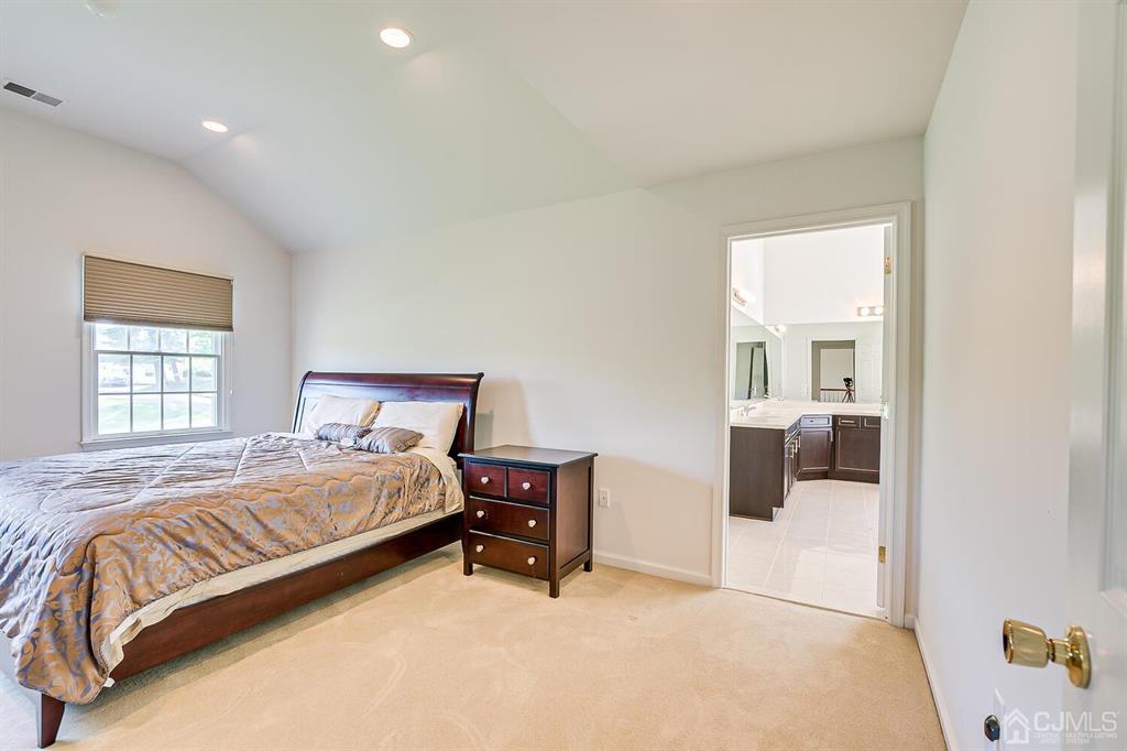 12 Hayduk Drive Edison, NJ 08820 - Photo 55 of 64 a bedroom with a bed and a couch