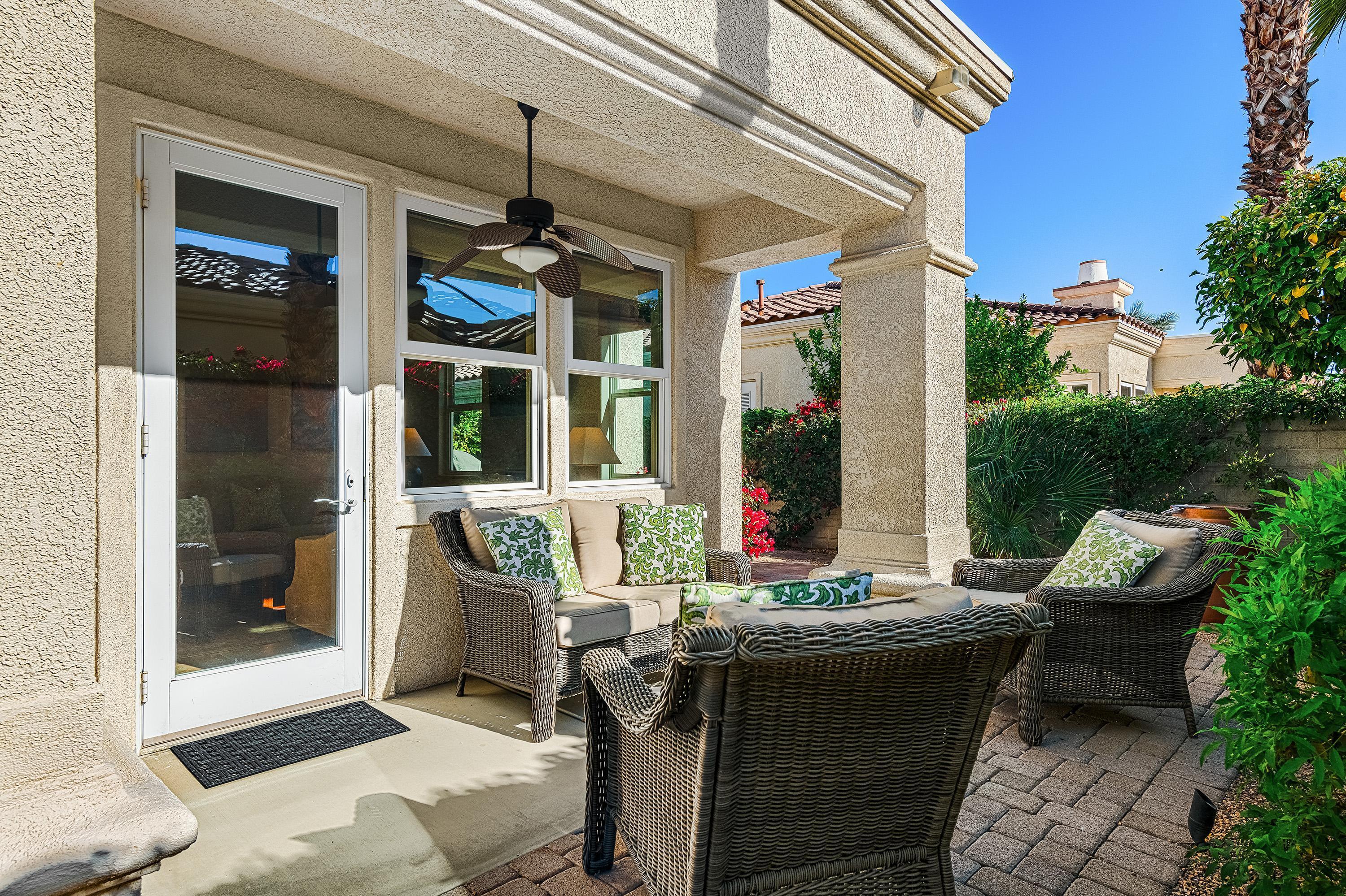 80921 Calle Azul La Quinta, CA 92253 - Photo 16 of 42 a view of a patio with table and chairs
