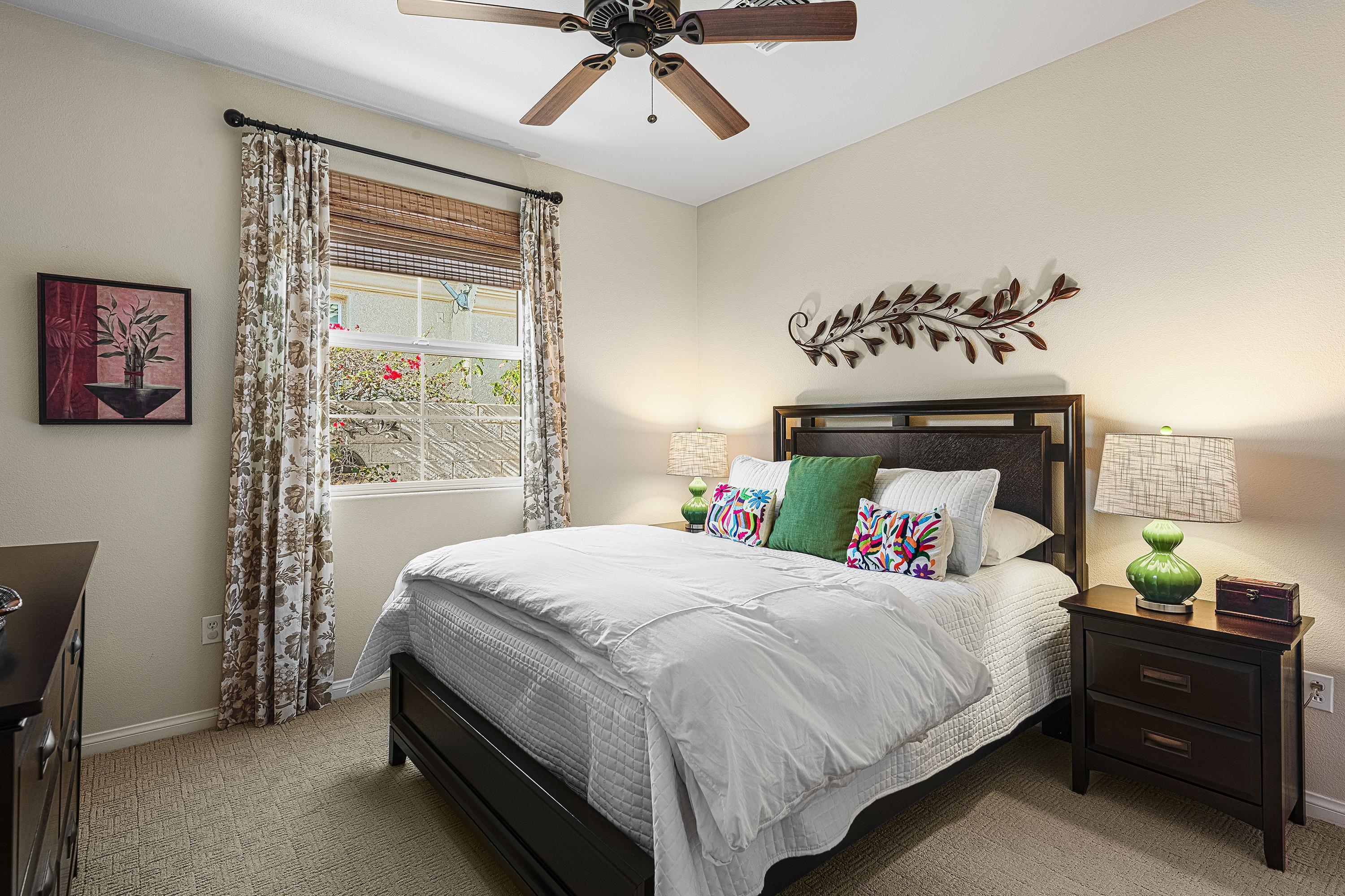 80921 Calle Azul La Quinta, CA 92253 - Photo 25 of 42 a bedroom with a bed and a window