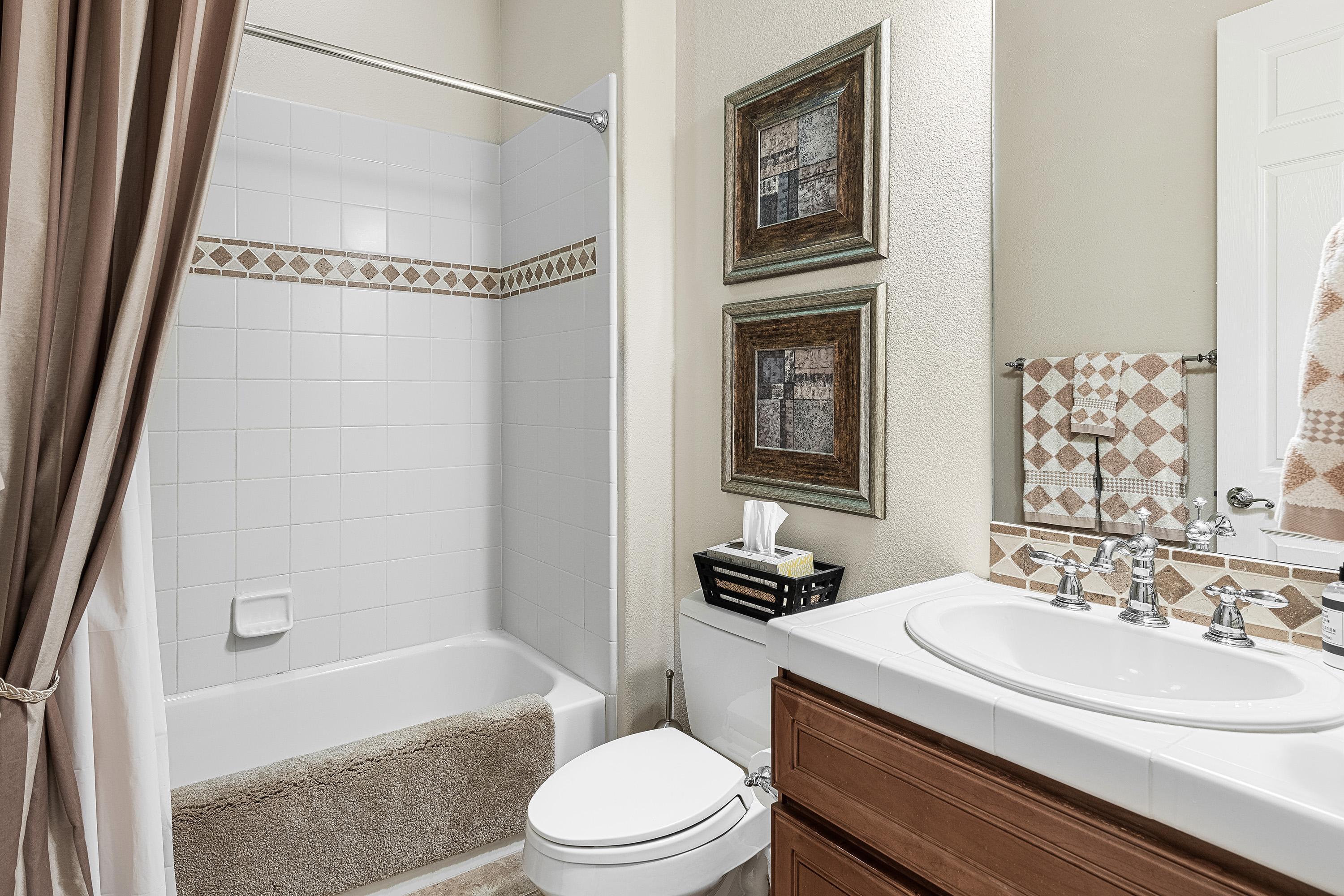 80921 Calle Azul La Quinta, CA 92253 - Photo 26 of 42 a bathroom with a sink a toilet and a bathtub