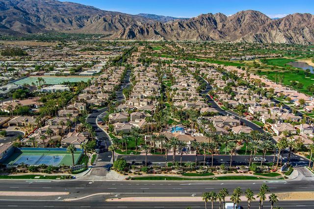 a living room with furniture fireplace and flat screen tv