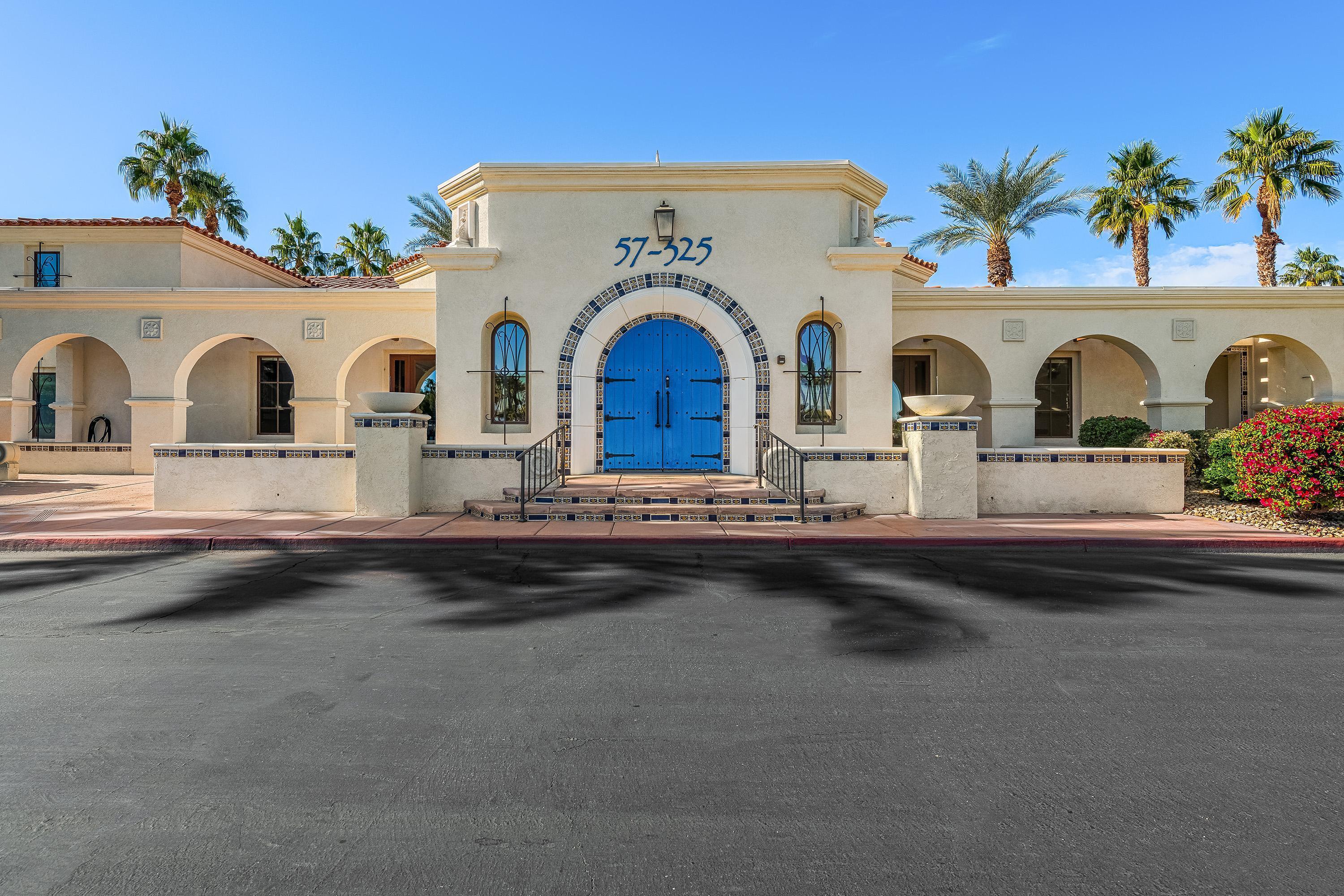 80921 Calle Azul La Quinta, CA 92253 - Photo 33 of 42 a view of front door with yellow lighting