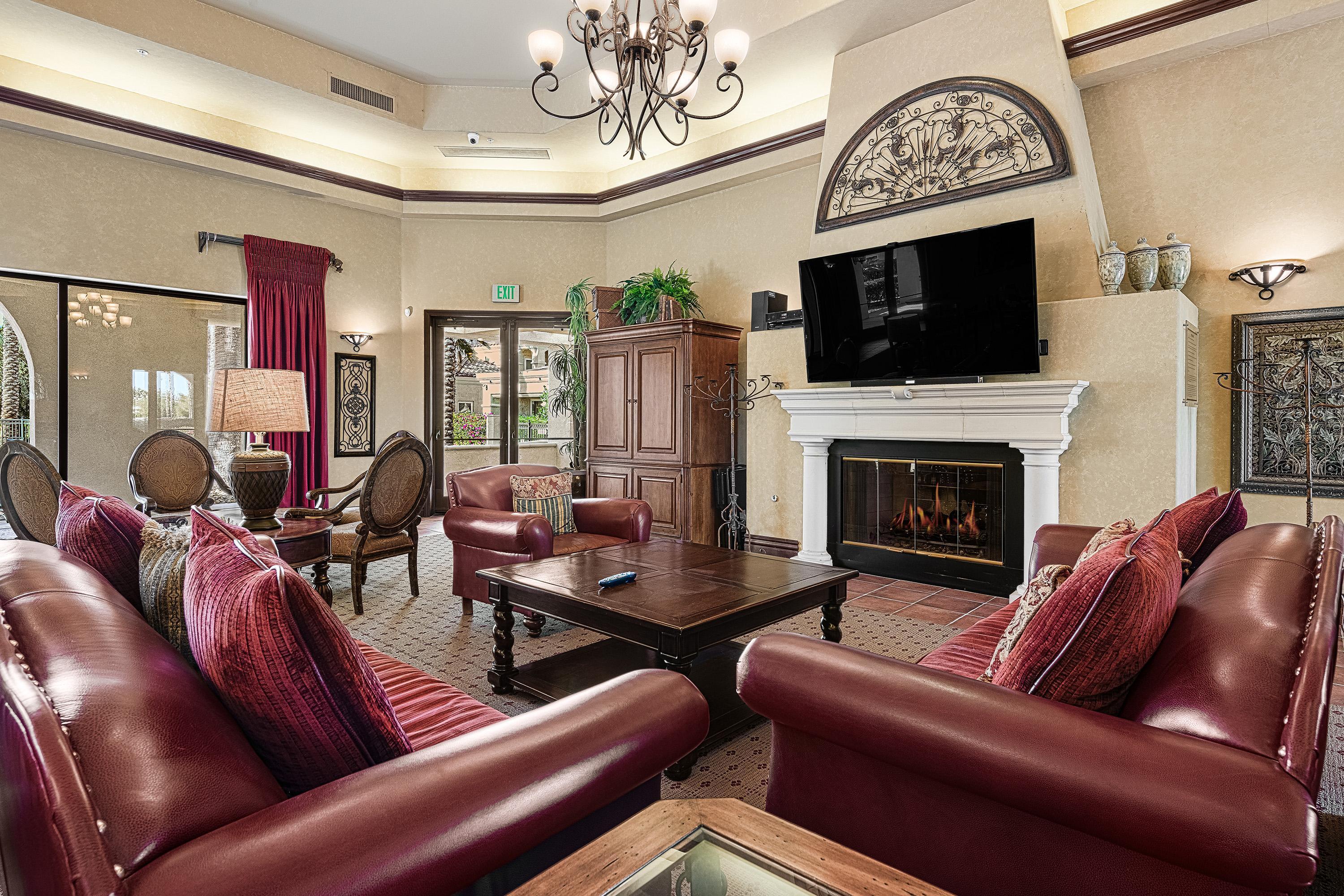 80921 Calle Azul La Quinta, CA 92253 - Photo 34 of 42 a living room with furniture fireplace and flat screen tv
