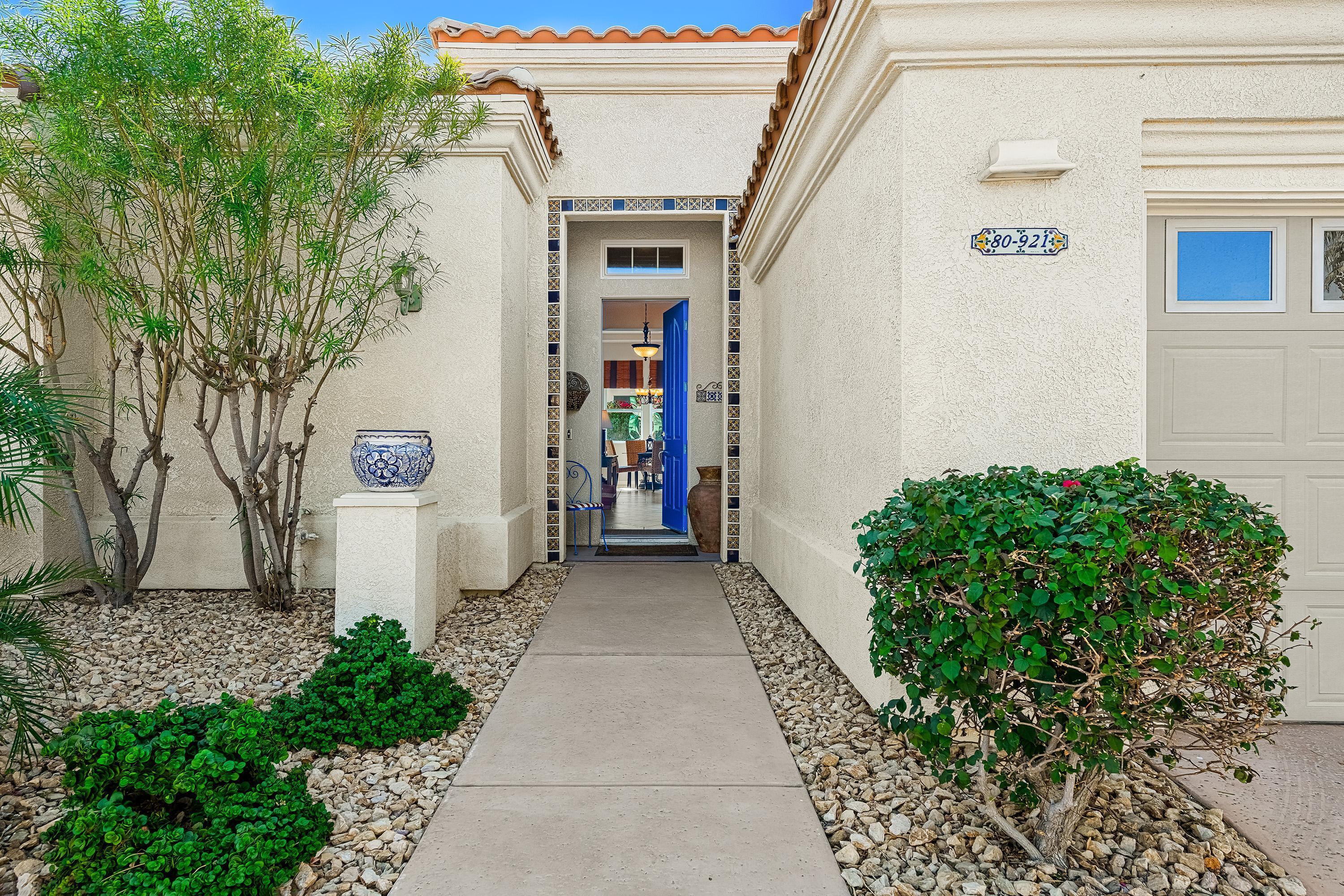 80921 Calle Azul La Quinta, CA 92253 - Photo 4 of 42 a front view of a house with a yard
