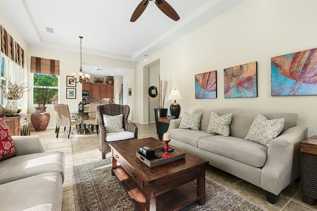 a kitchen with granite countertop a sink stove and cabinets