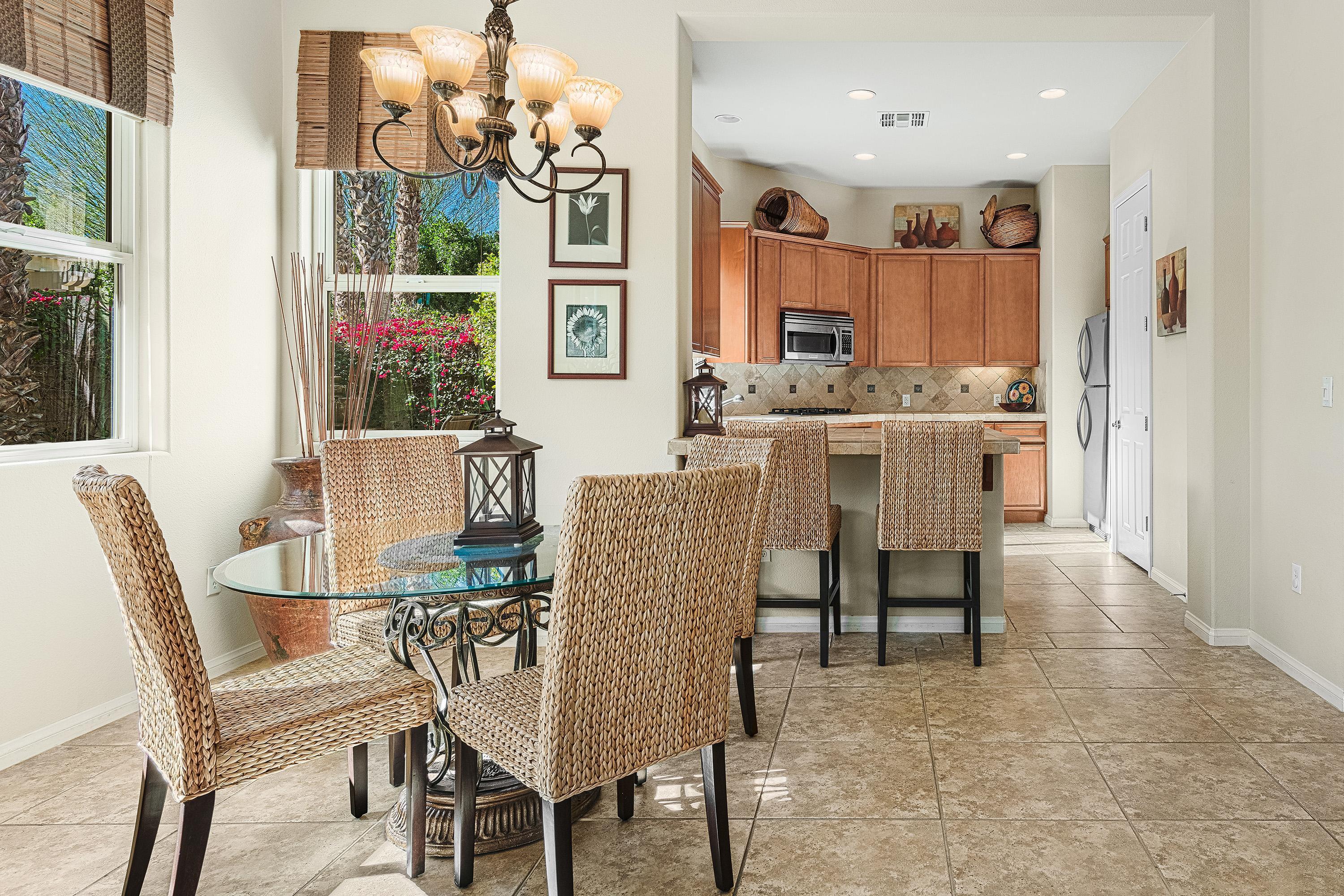 80921 Calle Azul La Quinta, CA 92253 - Photo 10 of 42 a view of a dining room with furniture and a chandelier