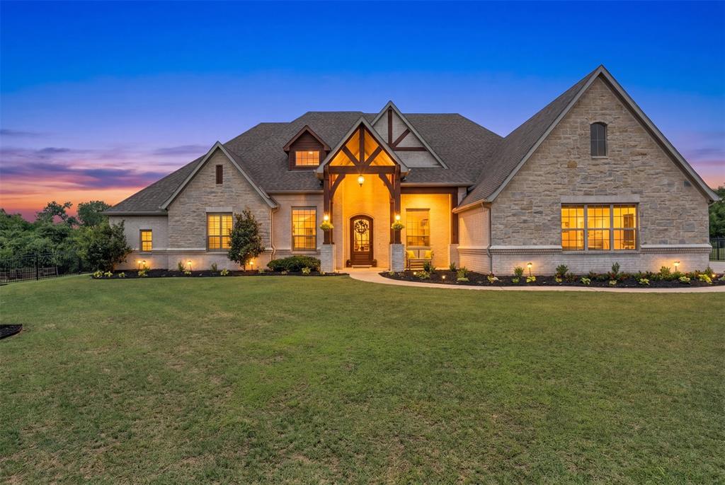 1060 Waters Edge Court Oak Point, TX 75068 - Photo 1 of 40 a front view of a house with a garden
