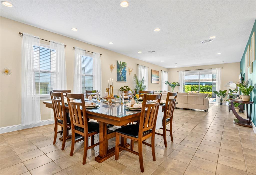 7639 Wilmington Loop Kissimmee, FL 34747 - Photo 13 of 79 a view of a dining area with furniture