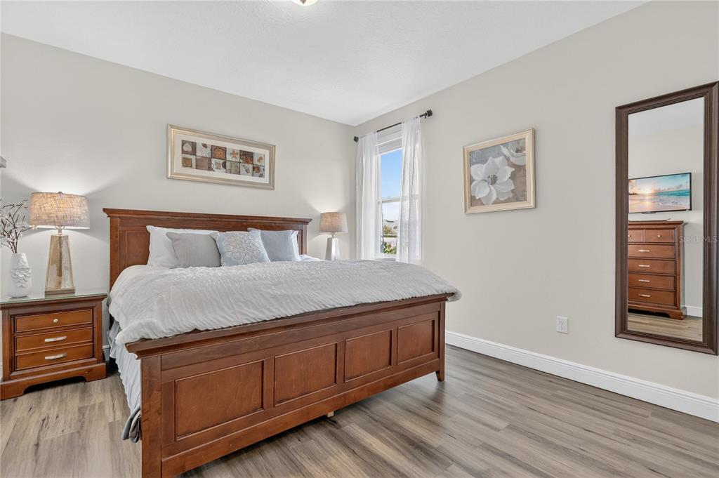 7639 Wilmington Loop Kissimmee, FL 34747 - Photo 52 of 79 a bedroom with a bed and a window