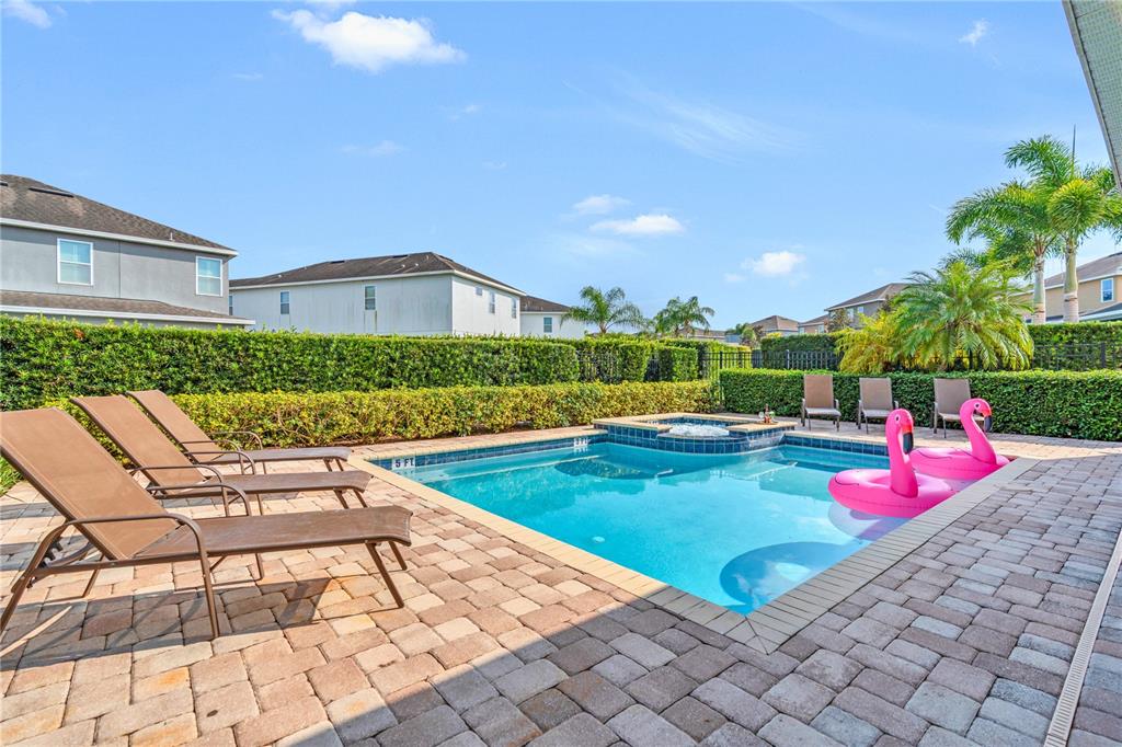 7639 Wilmington Loop Kissimmee, FL 34747 - Photo 58 of 79 a view of swimming pool with lounge chair