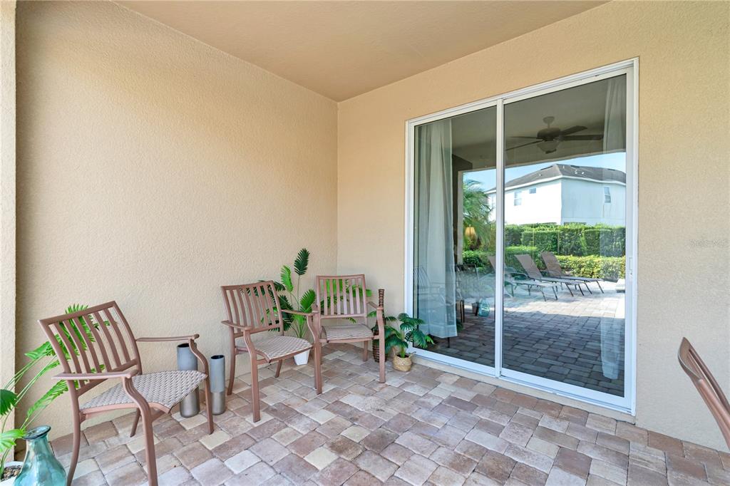 7639 Wilmington Loop Kissimmee, FL 34747 - Photo 62 of 79 a view of a room with chairs and front door
