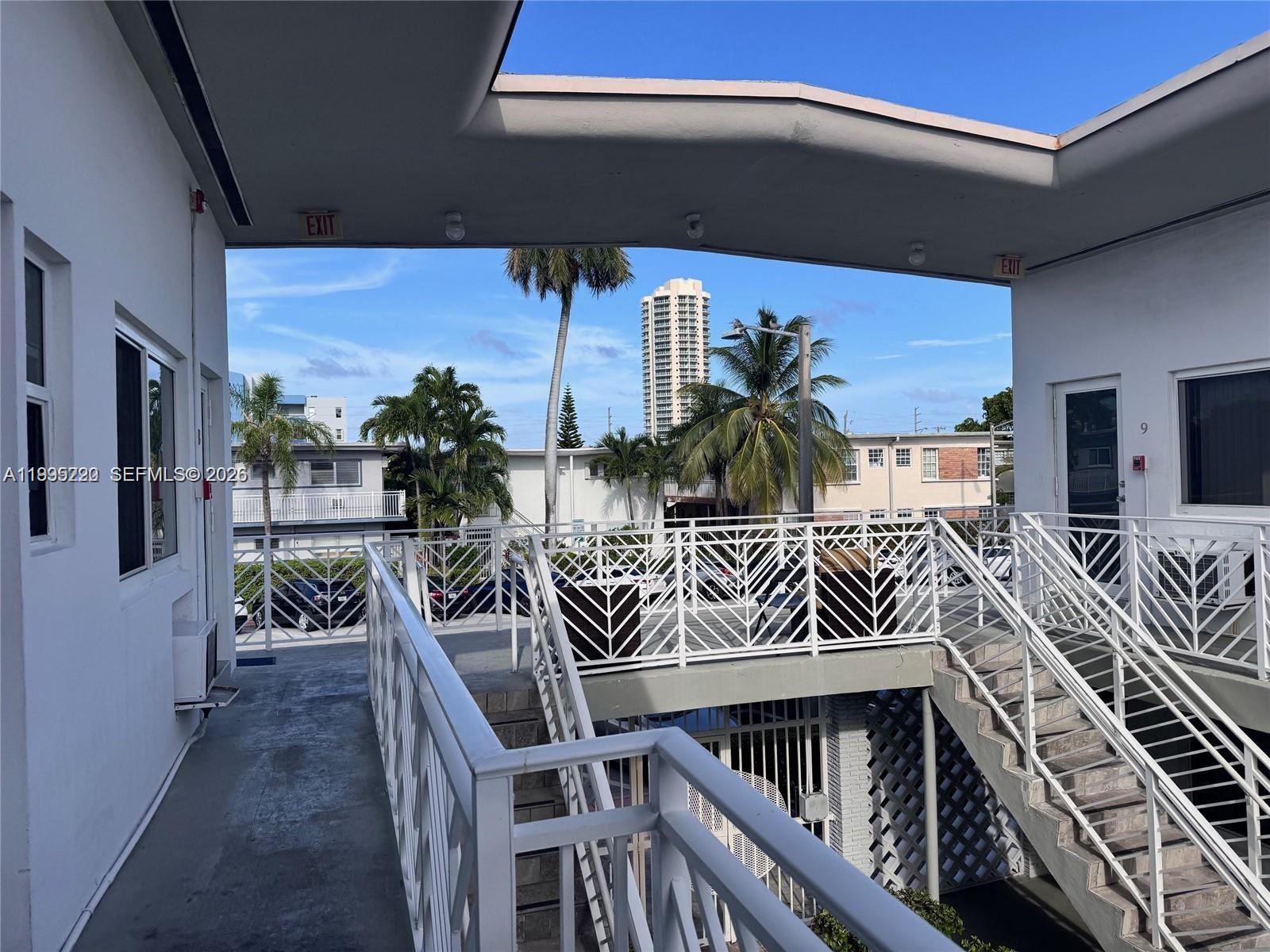 7440 Byron Avenue, Unit 12B Miami Beach, FL 33141 - Photo 18 of 22 a view of a chairs and table in the balcony