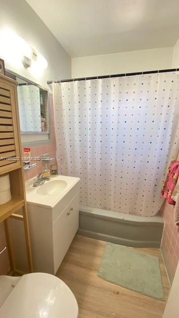 7440 Byron Avenue, Unit 12B Miami Beach, FL 33141 - Photo 21 of 22 a bathroom with a sink and a mirror