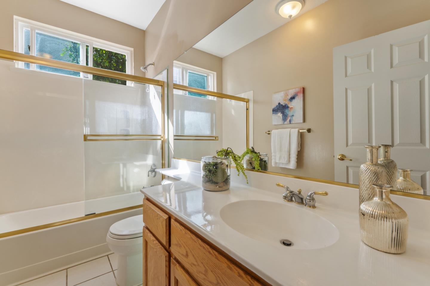 1559 Cindy Way Tracy, CA 95377 - Photo 15 of 28 a bathroom with a sink a toilet and mirror