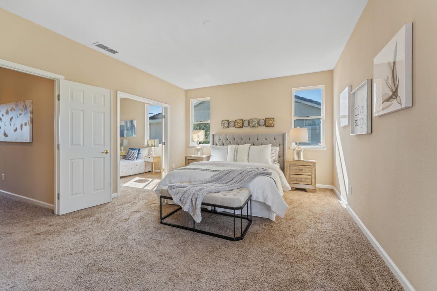 1559 Cindy Way Tracy, CA 95377 - Photo 20 of 28 a spacious bedroom with a bed and a cabinets