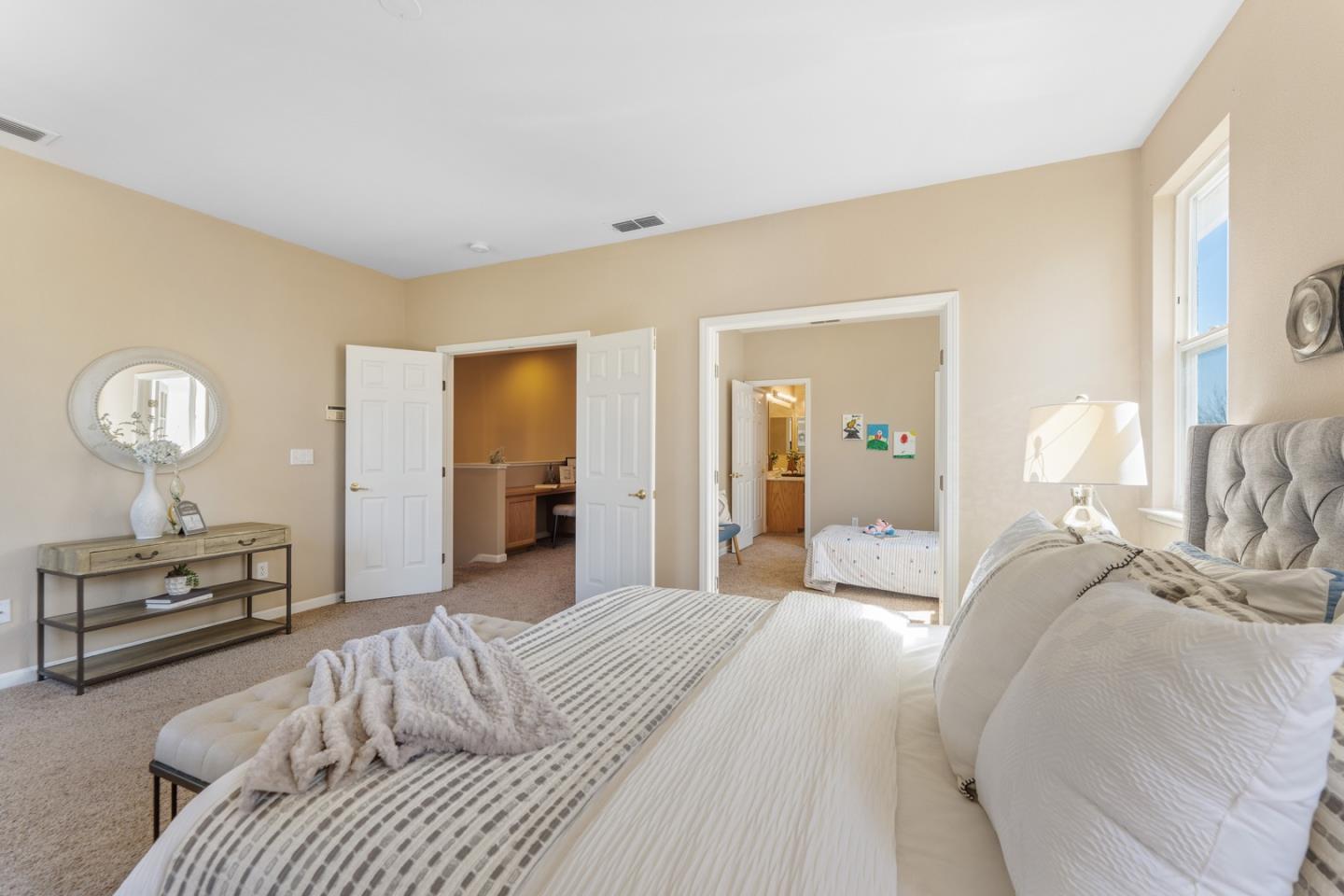 1559 Cindy Way Tracy, CA 95377 - Photo 21 of 28 a bedroom with a bed and a chandelier