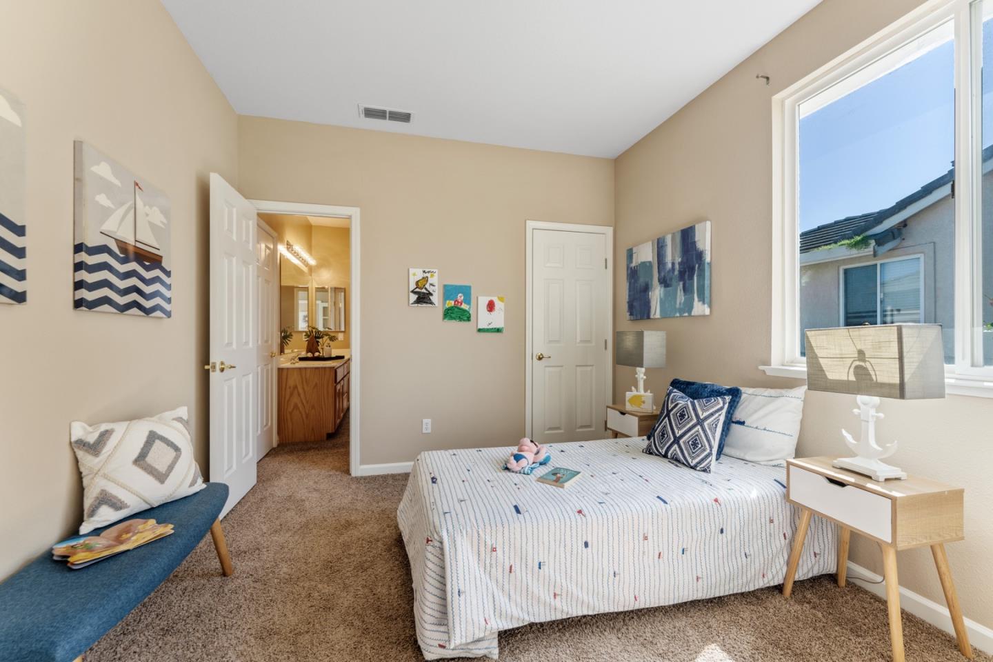 1559 Cindy Way Tracy, CA 95377 - Photo 22 of 28 a bedroom with a bed and cabinets