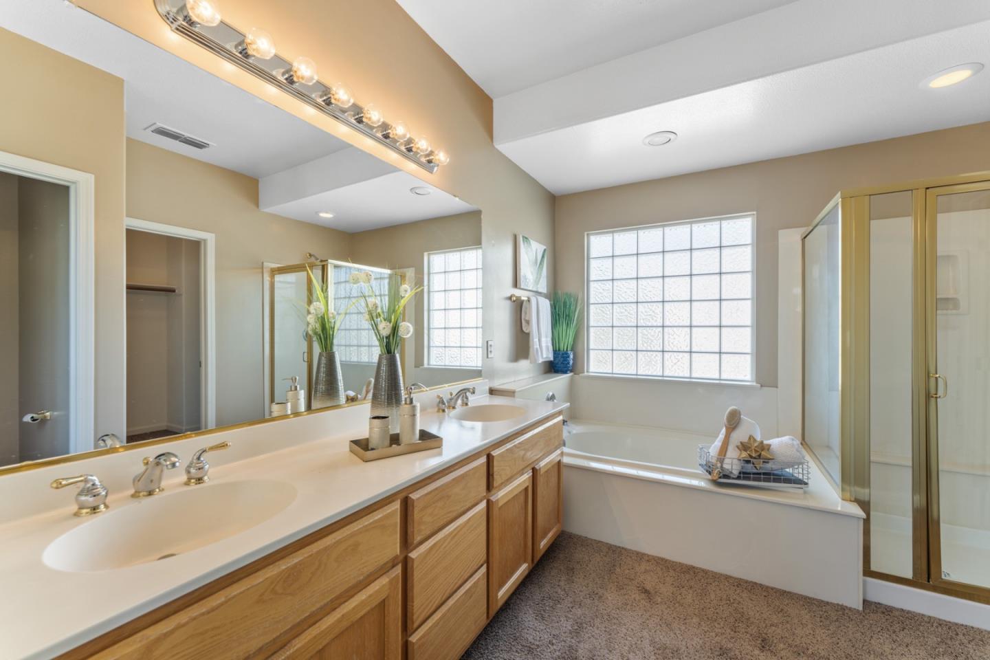 1559 Cindy Way Tracy, CA 95377 - Photo 23 of 28 a spacious bathroom with sink shower double vanity