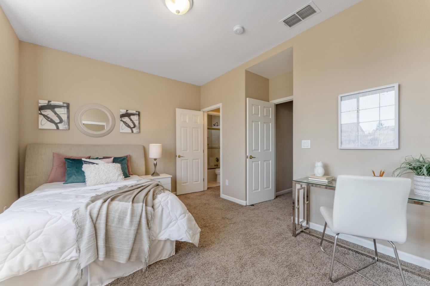 1559 Cindy Way Tracy, CA 95377 - Photo 24 of 28 a bedroom with a bed and a chair