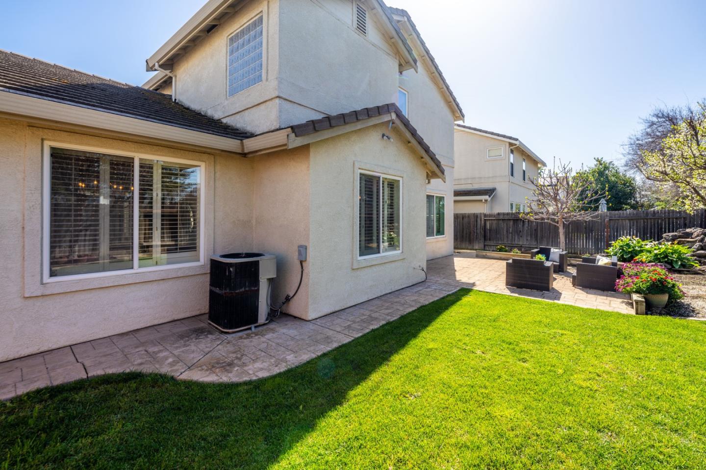 1559 Cindy Way Tracy, CA 95377 - Photo 28 of 28 a view of a house with backyard porch and sitting area