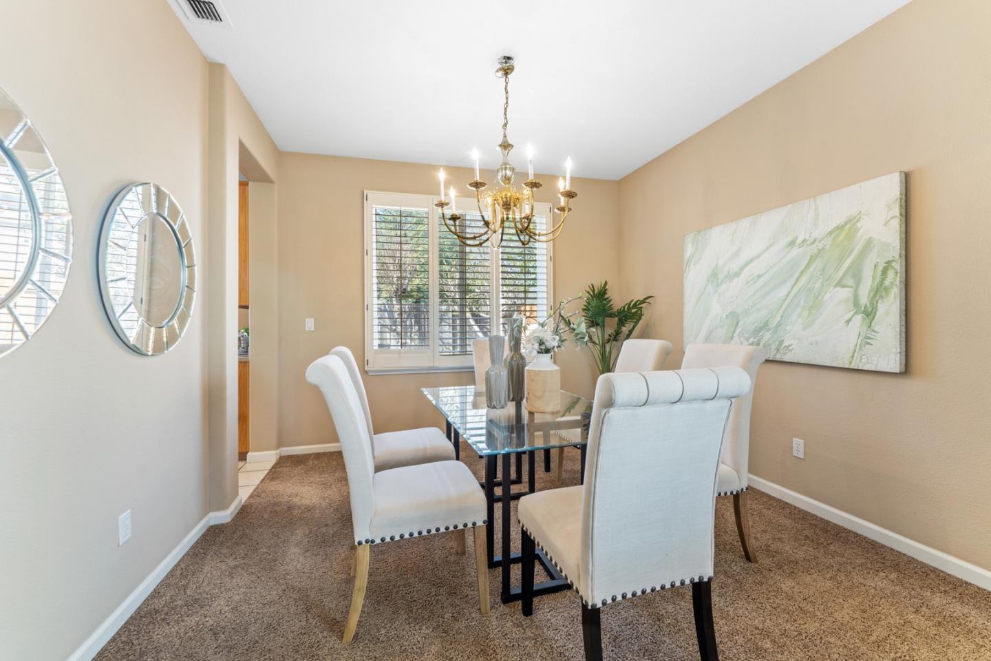 1559 Cindy Way Tracy, CA 95377 - Photo 7 of 28 a view of a dining room with furniture window and wooden floor