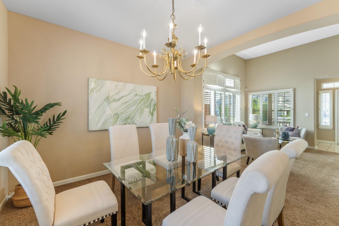 1559 Cindy Way Tracy, CA 95377 - Photo 8 of 28 a view of a dining room with furniture wooden floor and chandelier