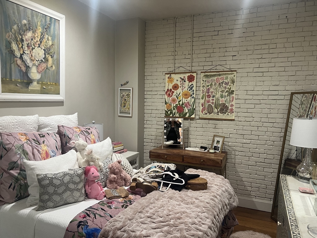 33 3rd Avenue, Unit U5B Boston, MA 02129 - Photo 14 of 16 a bedroom with a bed and a couch