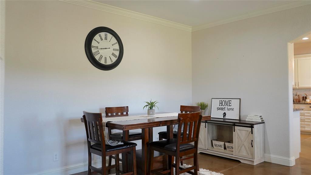 421 Weakes Street Eustace, TX 75124 - Photo 11 of 40 a view of a dining room with furniture and a window