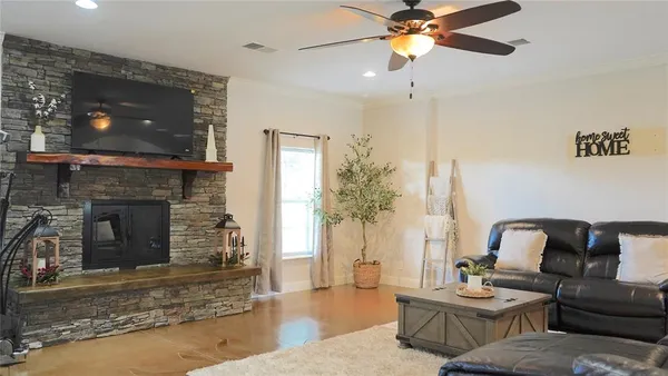 a living room with furniture and a fireplace
