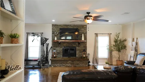 a living room with furniture and a fireplace