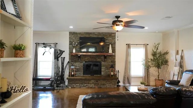 a living room with furniture and a fireplace