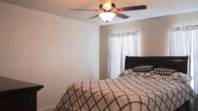 a bedroom with a bed and window