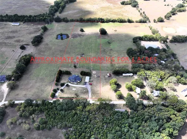 an aerial view of houses with yard