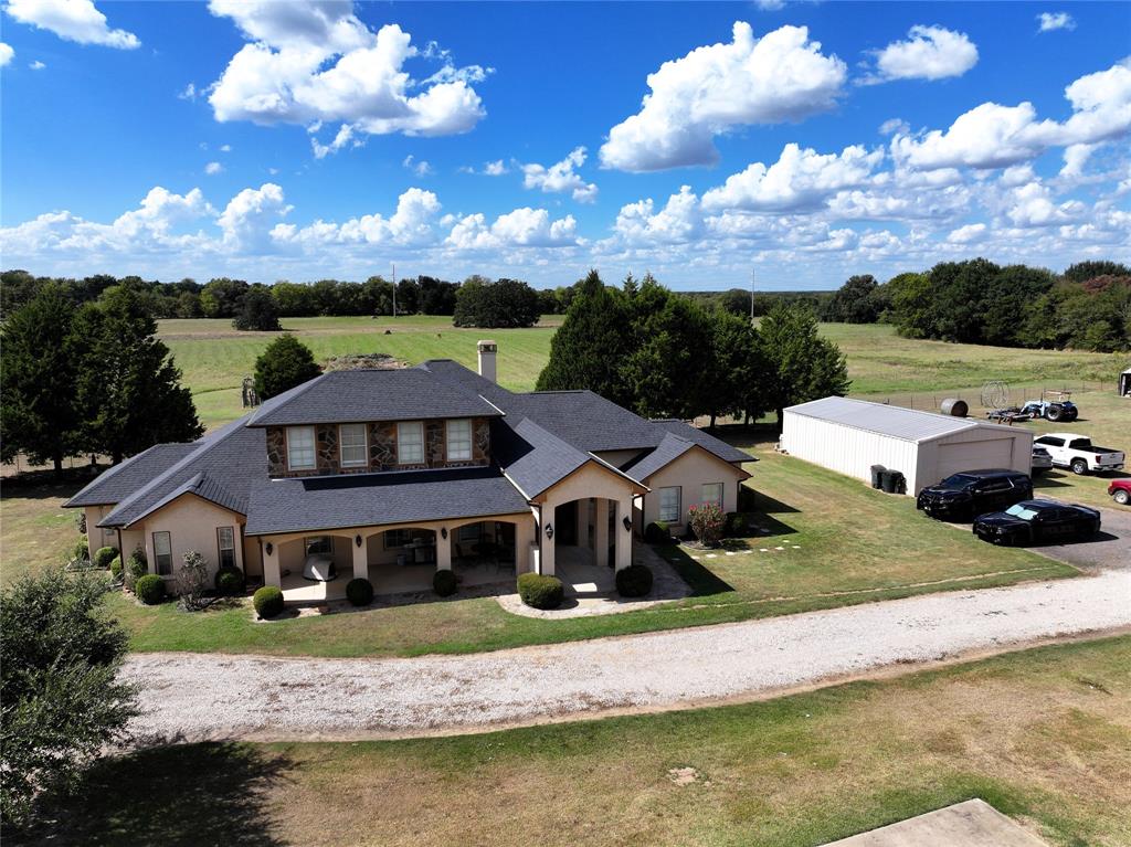 421 Weakes Street Eustace, TX 75124 - Photo 37 of 40 a front view of house with yard swimming pool and mountains in the background