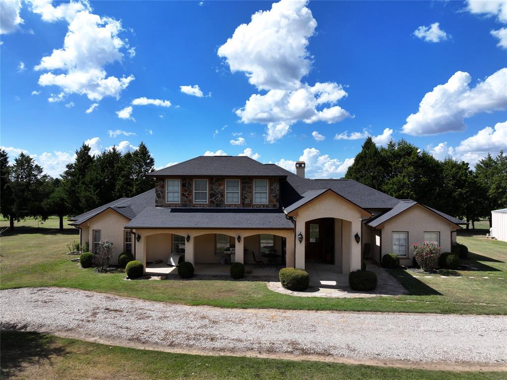 421 Weakes Street Eustace, TX 75124 - Photo 40 of 40 a front view of a house with a yard and garage