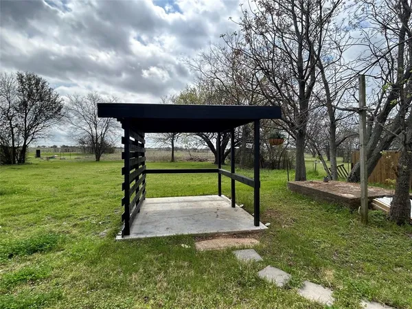 a view of a park with large trees