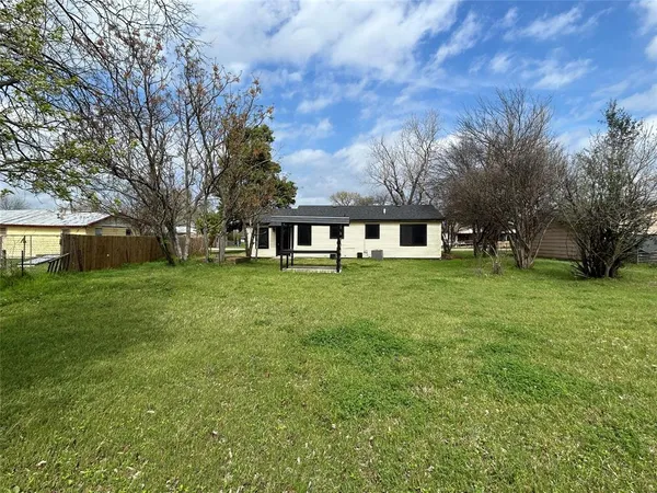 a view of a house with a big yard