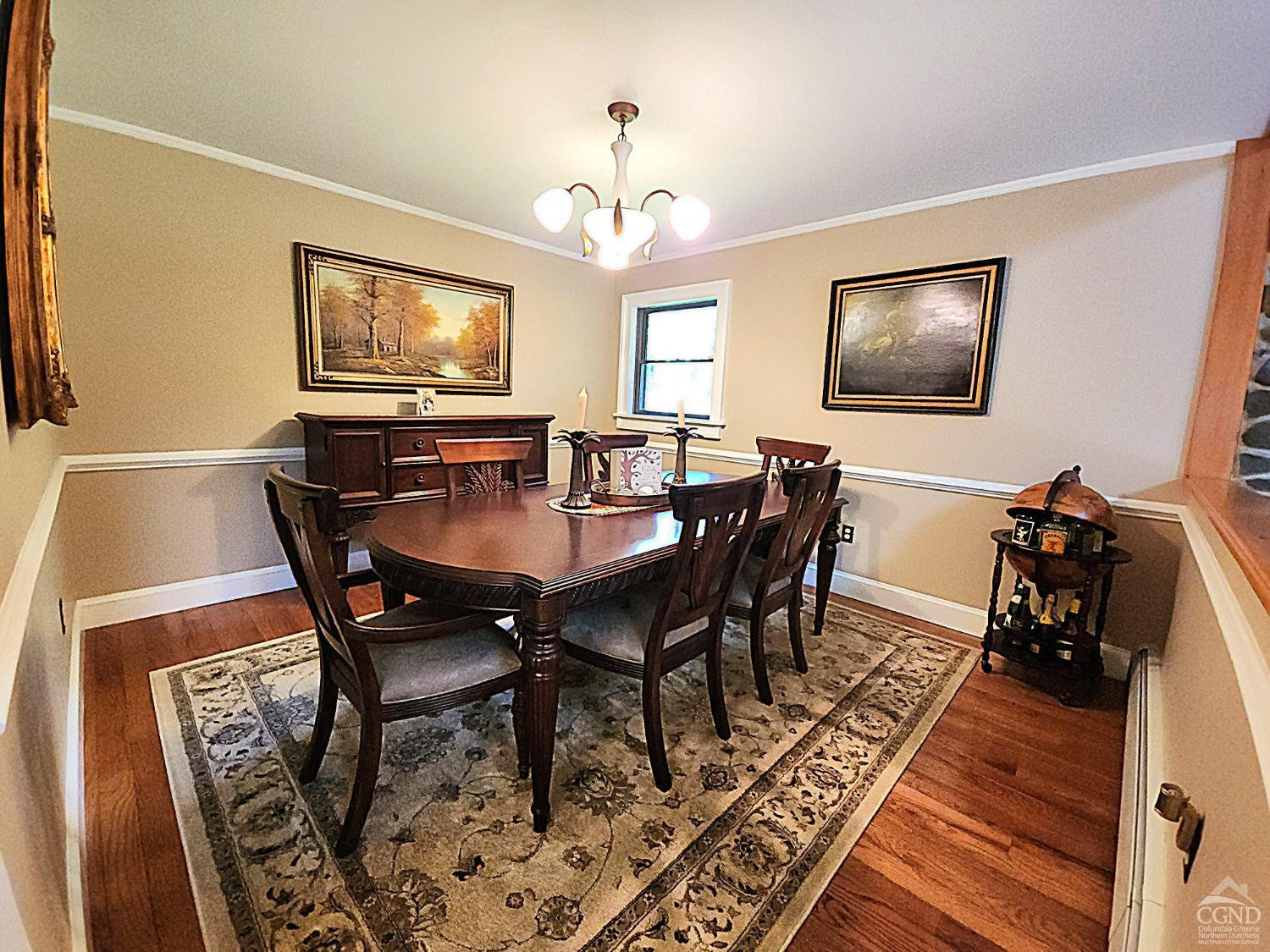 159 Toles Hollow Road Conesville, NY 12076 - Photo 20 of 53 a view of a dining room with furniture a rug and wooden floor