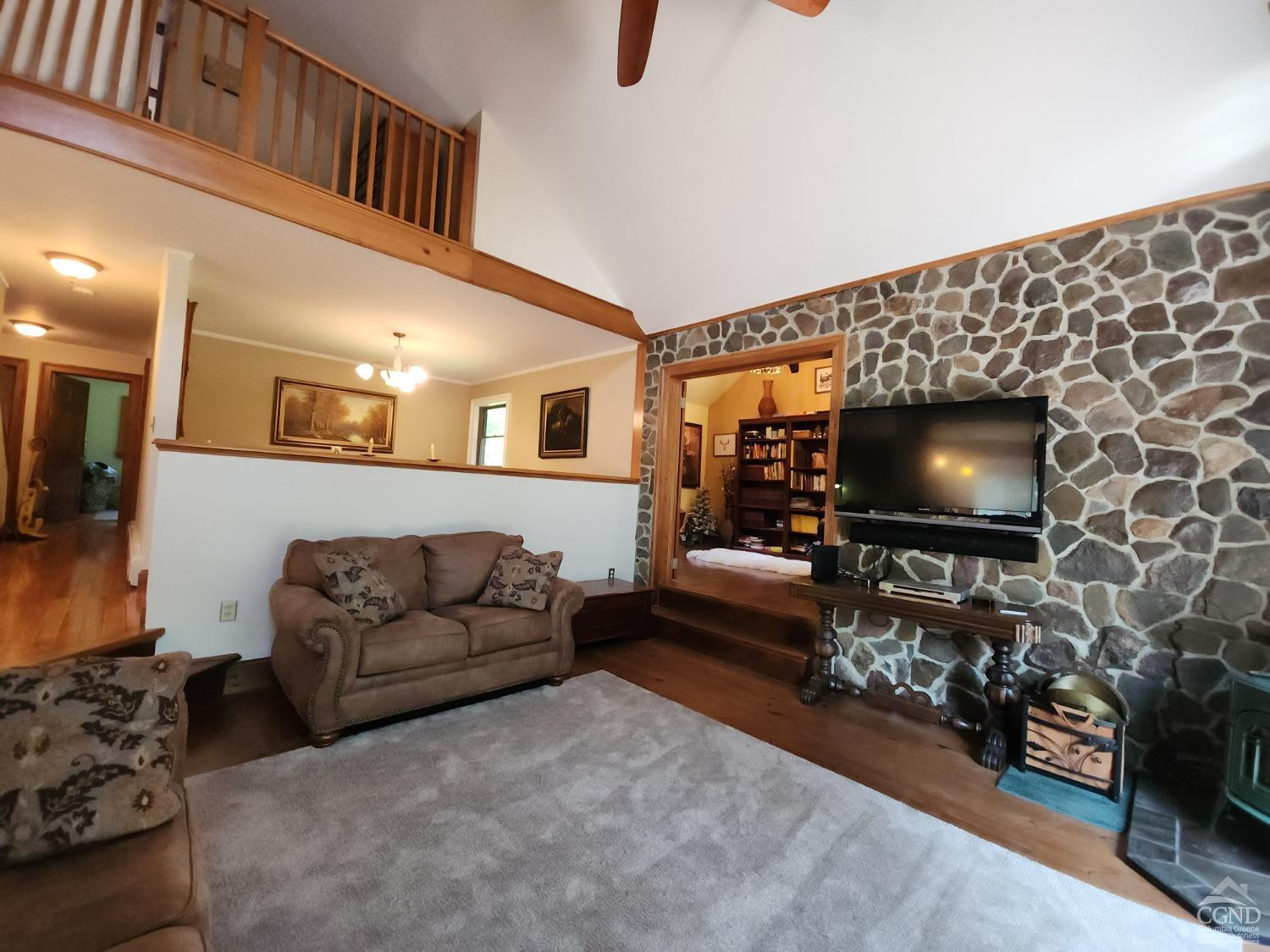 159 Toles Hollow Road Conesville, NY 12076 - Photo 23 of 53 a living room with furniture and a flat screen tv